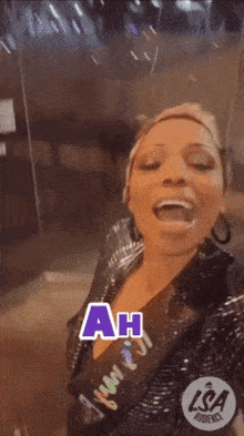 a woman is making a funny face and the words ah ha are on the screen