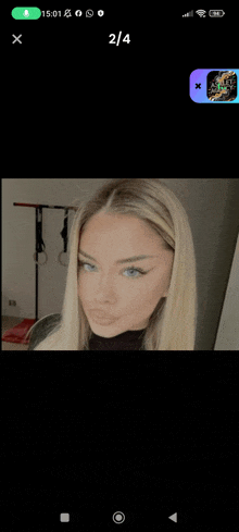 a screenshot of a woman 's face on a phone with the number 2 / 4 on the bottom right
