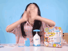 a woman is clapping in front of a box that says can do it good