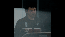 a man wearing a jacket that says 01 on it