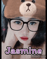 a girl wearing glasses and a teddy bear hat with the name jasmine