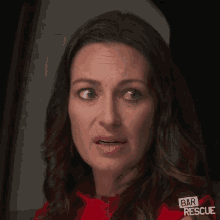 a woman wearing a red shirt that says bar rescue on it