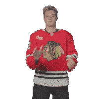 a hockey player wearing a jersey that says croce sports clapping his hands