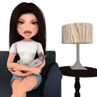 a doll is sitting on a chair holding a cat