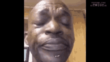 a close up of a man 's face with his eyes closed and the word sniff on the bottom