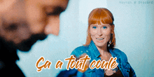 a woman in a denim jacket is smiling next to a man with the words ca a tout coule written on the bottom