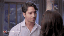 a man and a woman are looking at each other on a sony tv channel