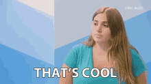 a woman in a blue shirt says that 's cool in white letters