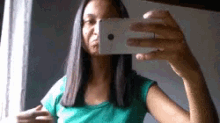 a woman taking a selfie with her phone