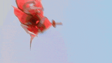 a close up of a robot with a red heart on it