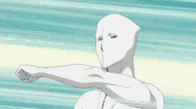 a cartoon character with a white mask on his face is holding a glove in his hand .