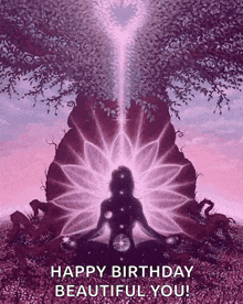 a woman is sitting in a lotus position under a tree with a light coming from it .