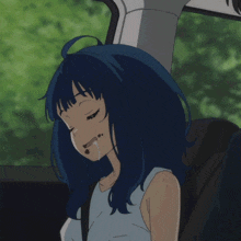 a girl with blue hair is sitting in a car