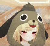 a girl wearing a hoodie that looks like a dog with a poop on her head