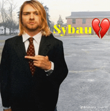 a man in a suit and tie is pointing at his chest with sybau written on the bottom
