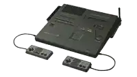 a black sharp video game console with two controllers attached to it