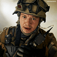 a close up of a soldier 's face with the words joequinncraves above him