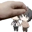 a hand is petting a boy and girl holding hands .