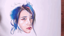 a person is painting a woman 's face with blue hair