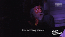 a man with a beard is on a screen that says astro citra
