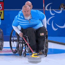 pushing the curling stone wheelchair curling steve emt usa paralympics