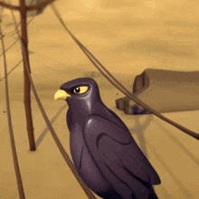 a purple bird with a yellow beak is standing on a rope