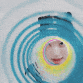 a close up of a woman 's face in a circle with a colorful background .