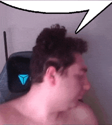 a man without a shirt has a speech bubble over his head