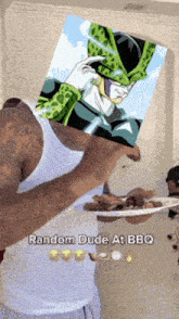 a man in a white tank top is holding a plate of food and a picture of a cell from dragon ball z on his head