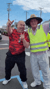 two men are posing for a picture and one is wearing a shirt that says u.s. army