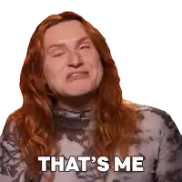 a man with long red hair is making a funny face and says that 's me