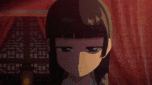 a close up of a girl 's face with a red curtain behind her