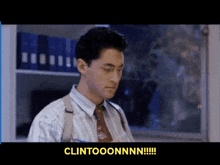 a man in a striped shirt and tie says clintonnn !!!