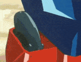 a close up of a cartoon character 's leg with a blue and red item in it .
