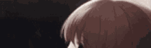 a close up of a person touching a girl 's head .