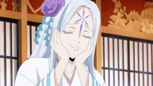 a woman with white hair and a purple flower in her hair is smiling