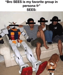 a group of people are sitting on a couch with a robot sitting on the couch