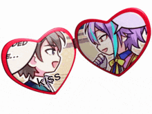 a couple of heart shaped buttons with the word kiss on them
