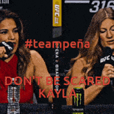 two women are sitting at a table with microphones and a can of monster energy drink in front of them