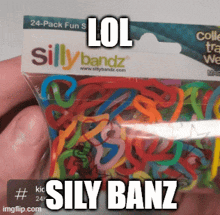a person is holding a bag of silly bandz bracelets and says lol sily banz