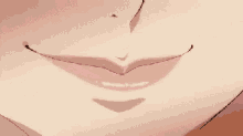 a close up of a woman 's mouth with her tongue out .