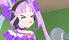 a girl with purple hair and headphones is making a funny face