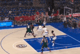 a basketball game is being played on a court that has the number 10 on it