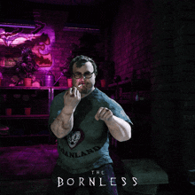 a man wearing a shirt that says the bornless on it