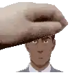 a hand is holding a man 's head in a pixel art .