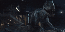 a large dinosaur is standing in front of a building with a sign that says ' a '