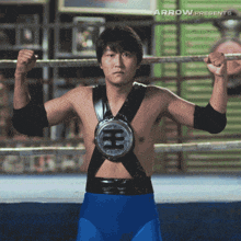 a man in a boxing ring with arrow presents on the bottom right