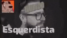 a man with glasses and a beard is wearing a hat with the word mundo on it