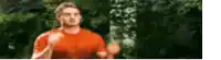 a blurry picture of a man in a red shirt running