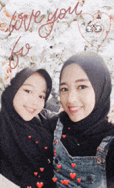two women are posing for a picture with the words " love you for " written in red